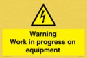 warning-work-in-progress-on-equipmentwith-electrical-hazard-symbol~